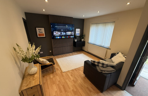 Lounge with media wall at 24 Broom Walk